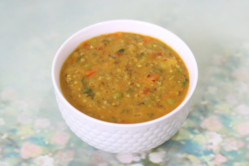 Masala Bajre ki Khichdi is a winter dish from Rajasthan is made with Bajra (pearl millet), moong dal, vegetables and spices.