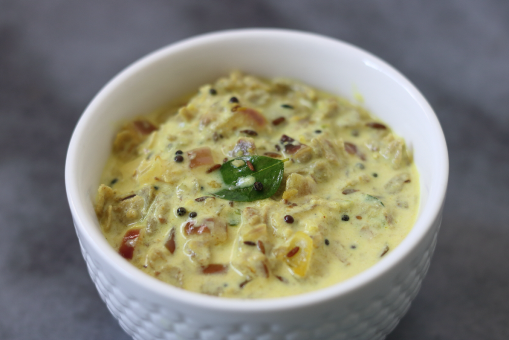 Vagharelo Rotlo, the traditional Gujarati winter dish of pieces of Bajra Roti cooked in a spiced buttermilk gravy.