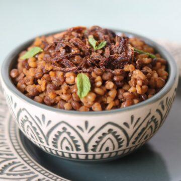 Mujadara, the vegan middle-eastern pilaf made with whole brown or green lentils, caramalized onions, and bulgur (or rice)