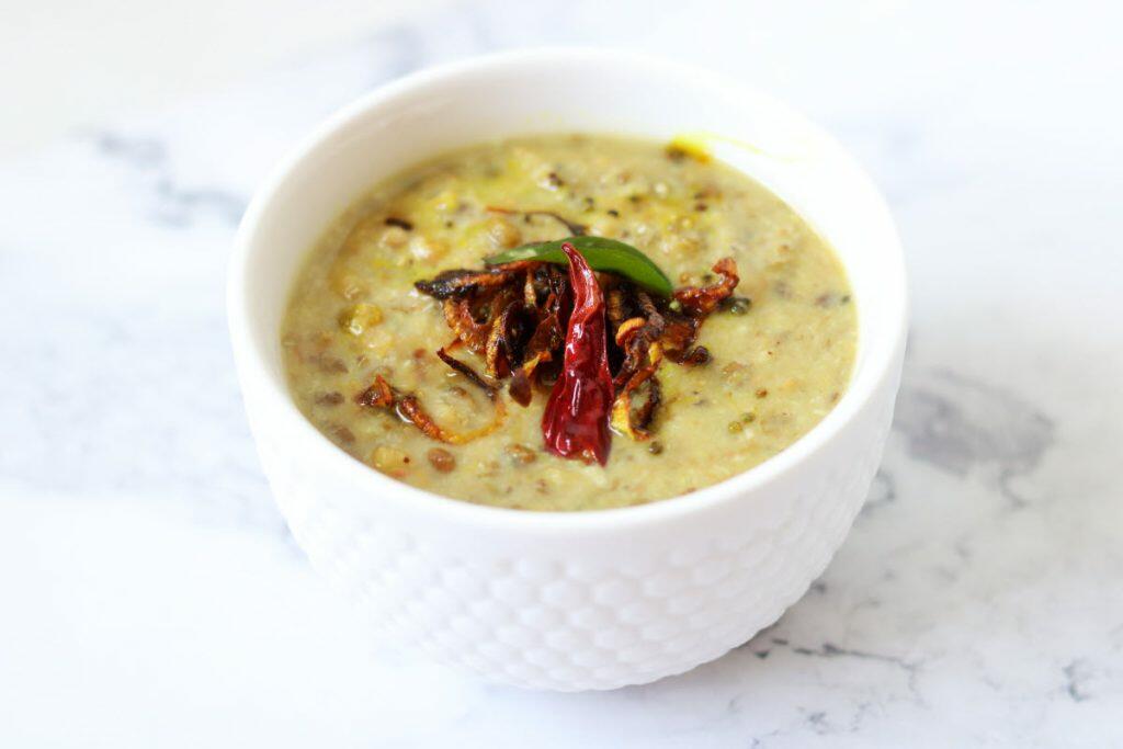 Kerala Parippu Curry made with roasted green moong beans and flavoured with coconut.