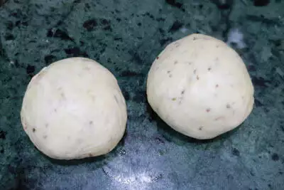 The dough divided into 2 parts.