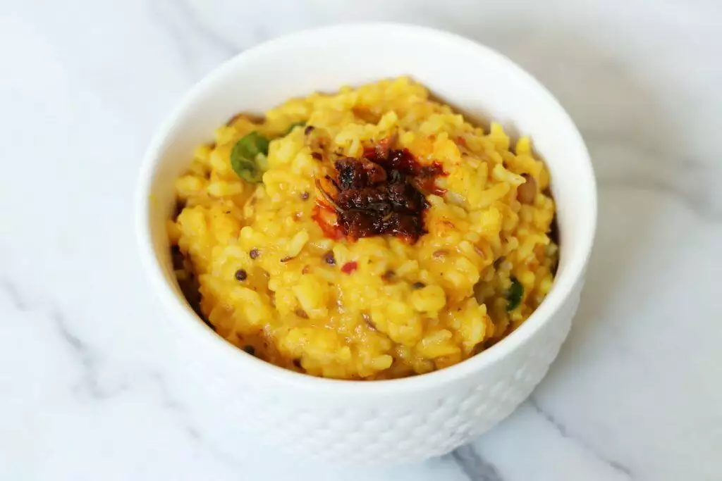 Ghee-laden Dal Rice into Gongura Pachadi mixed into it