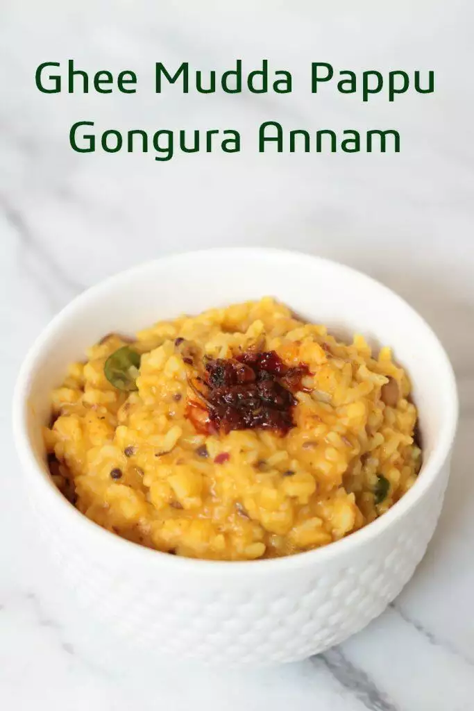 Gongura Pachadi mixed into plain dal rice and topped with ghee.