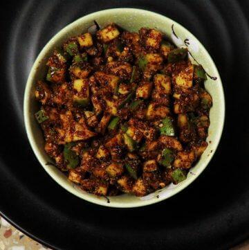 Small pieces of mango pickled in a mustard-chilli-fenugreek paste